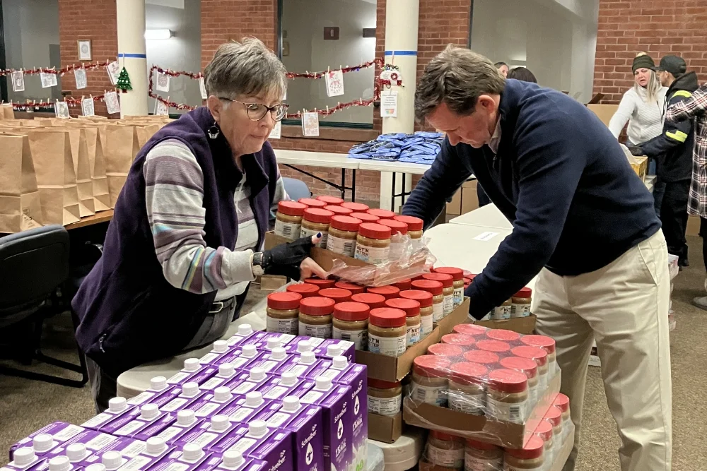 Matt Fink and Donna Coyle sorting food